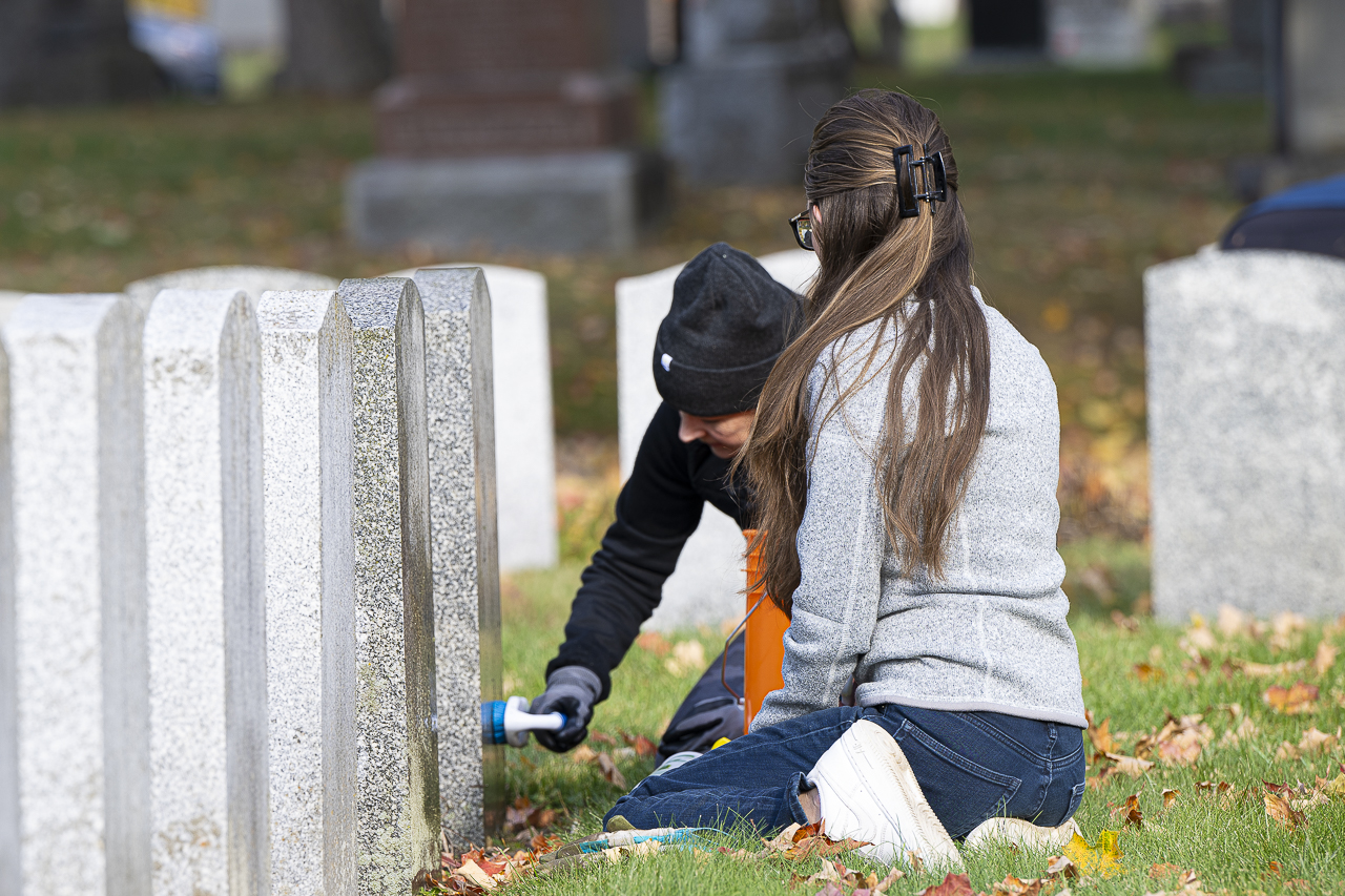 Cleaning headstones - Richard Lawrence Photography