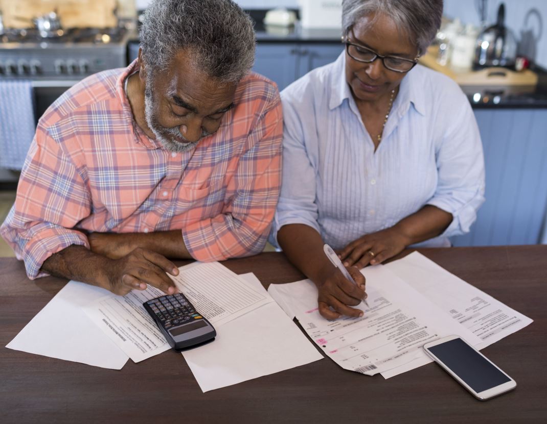 Older couple filling out forms