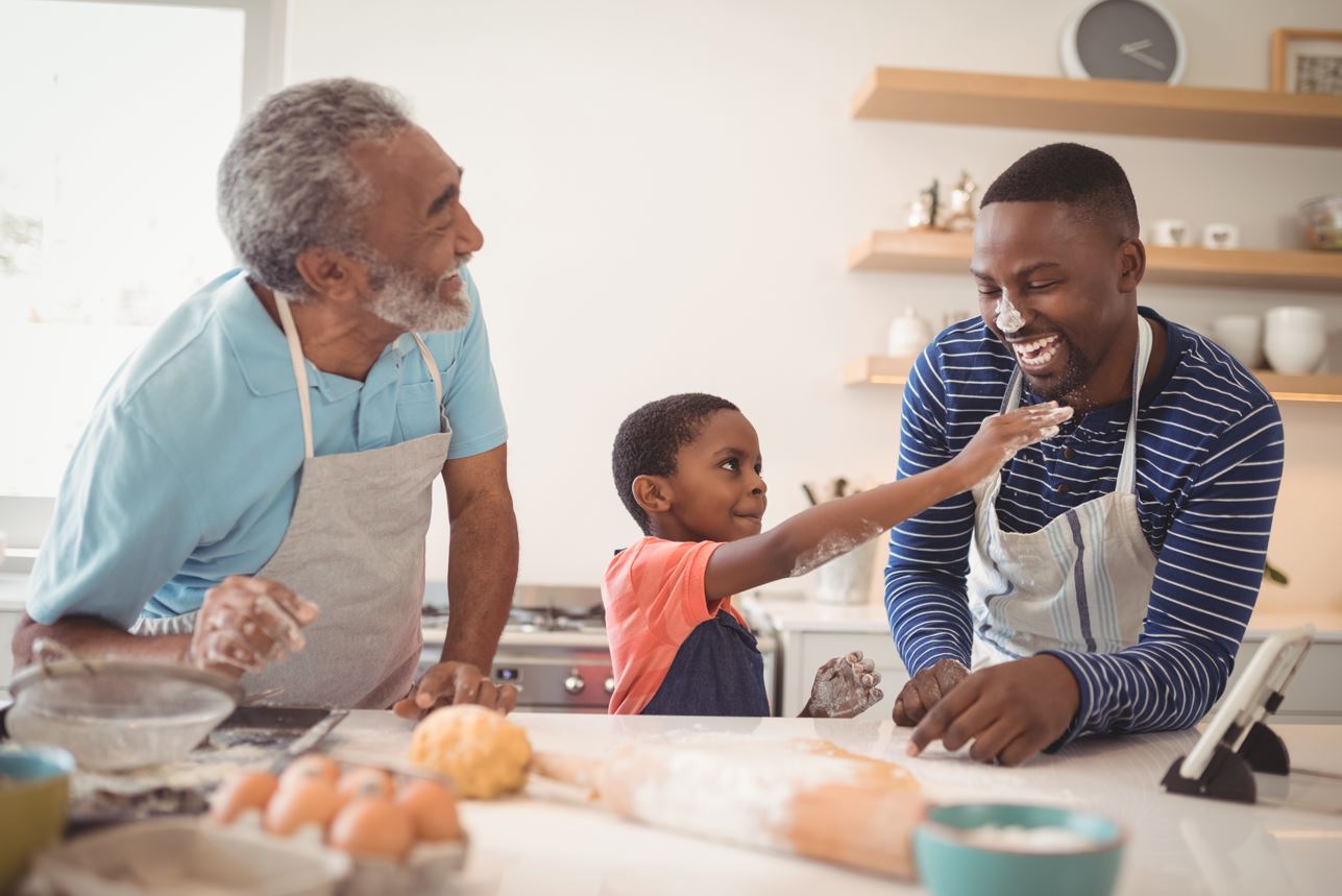 Family baking together and enjoying themselves