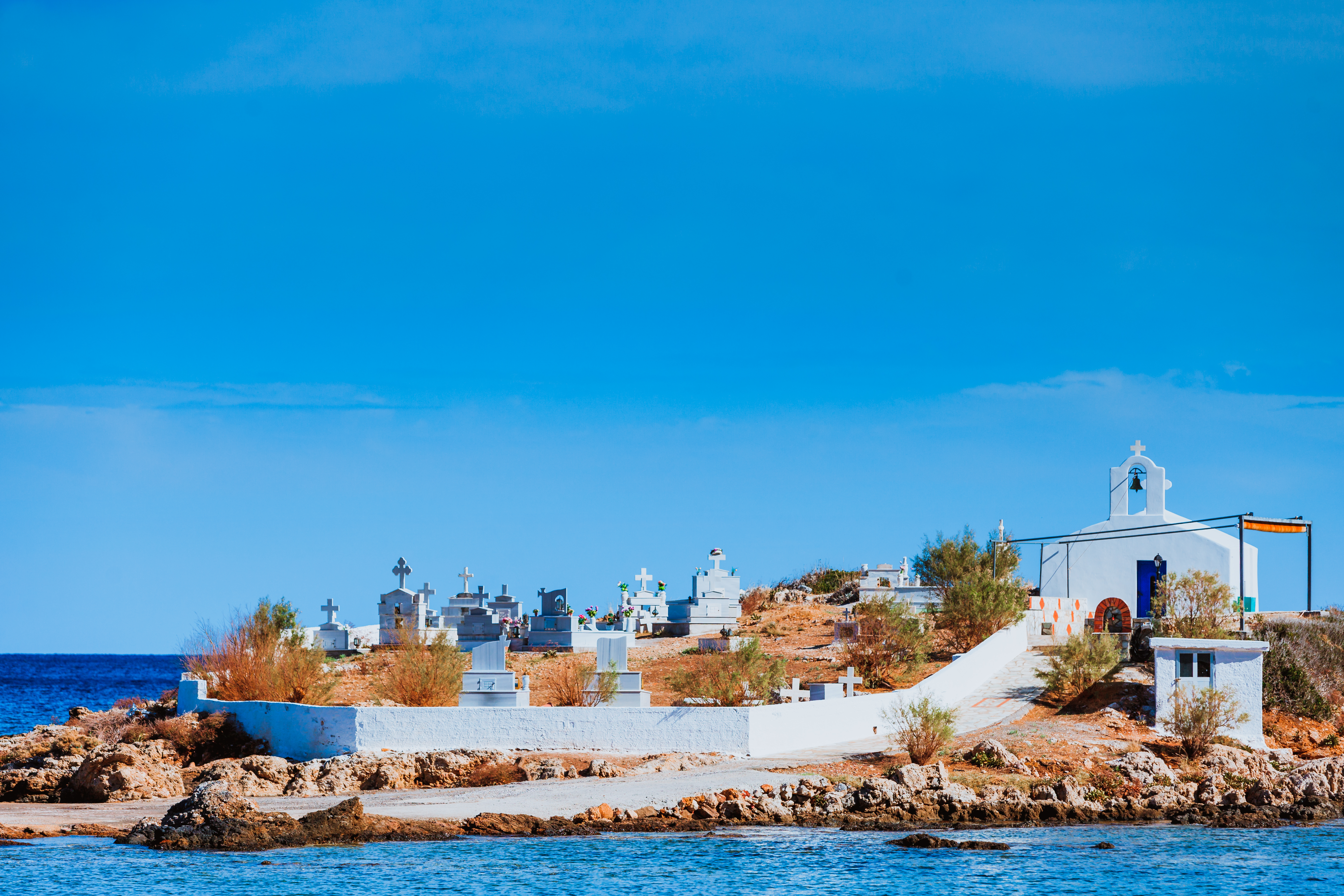 Agios Fokas near Monemvasia. Small cemetery graveyard on sea shore in Laconia region Peloponnese.