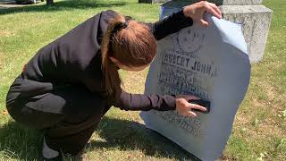 Beechwood Staff member doing a rubbing on an old monument